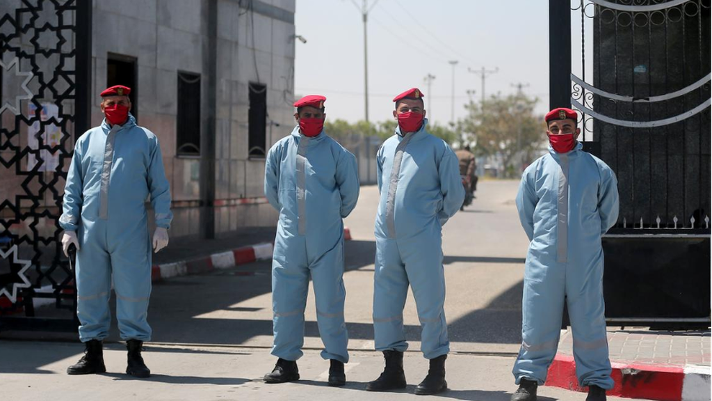 Members of Palestinian Hamas security forces wear protective gear as precaution against coronavirus 