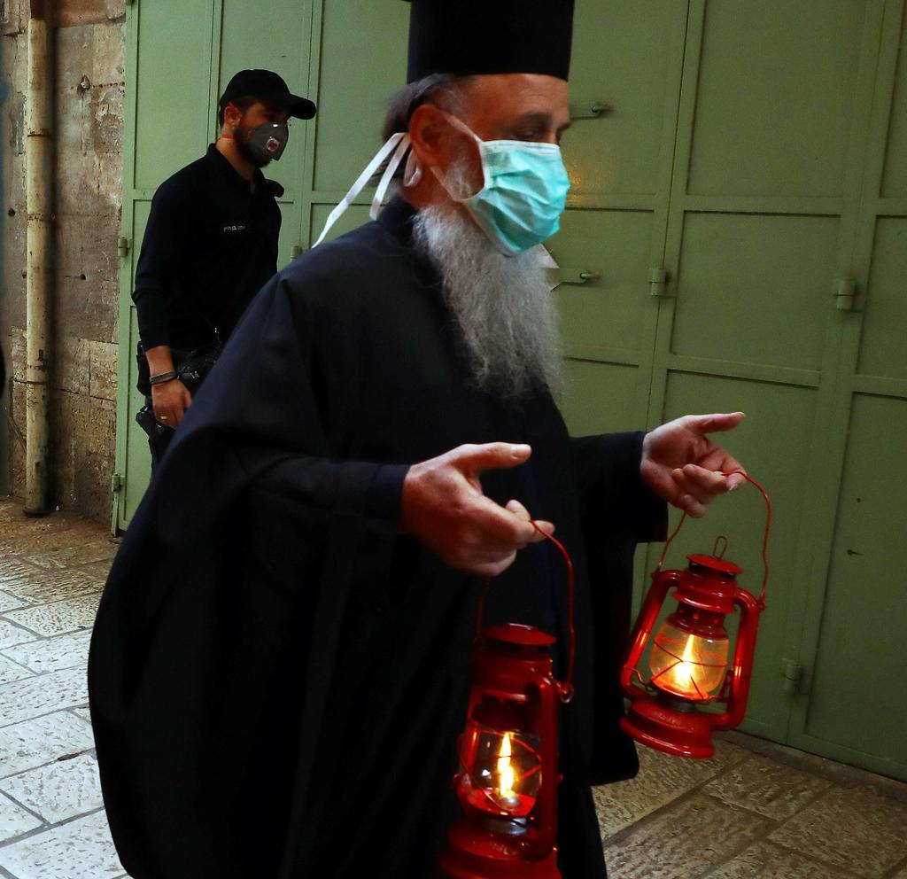 An Orthodox Christian clergy on his way to the Holy Fire ceremony 