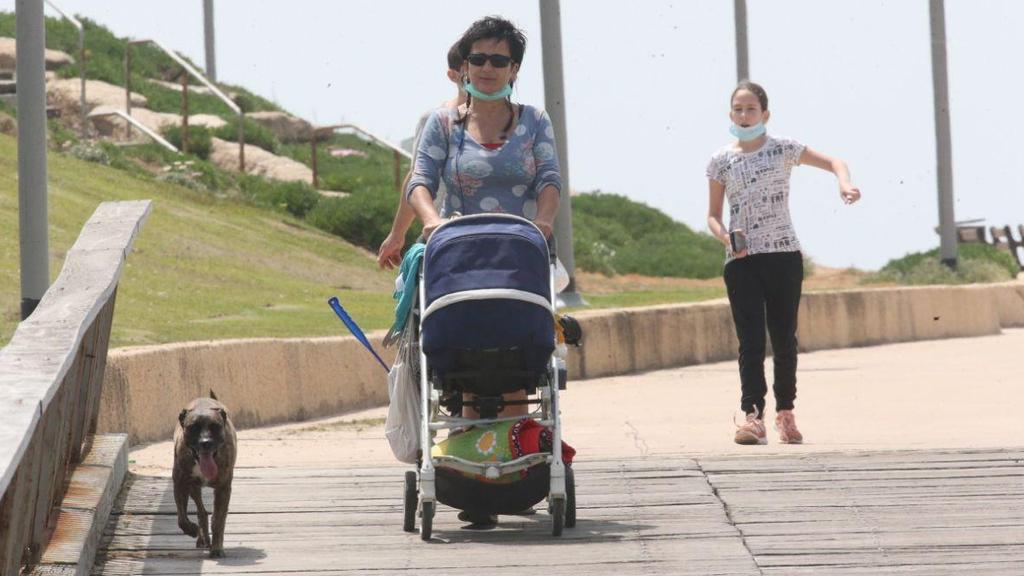 Israelis walking on Tel Aviv beachfront amid the coronavirus  crisis 