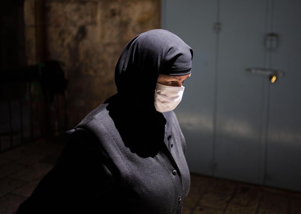 A nun walks through the old city of Jerusalem