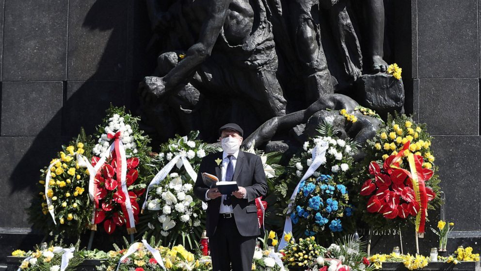 Poland's chief rabbi, Michael Schudrich, says prayers before the monument to the heroes of the 1943 Warsaw Ghetto Uprising in Warsaw, Poland 