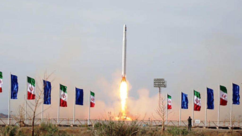 Iranians launch a rocket carrying a satellite 