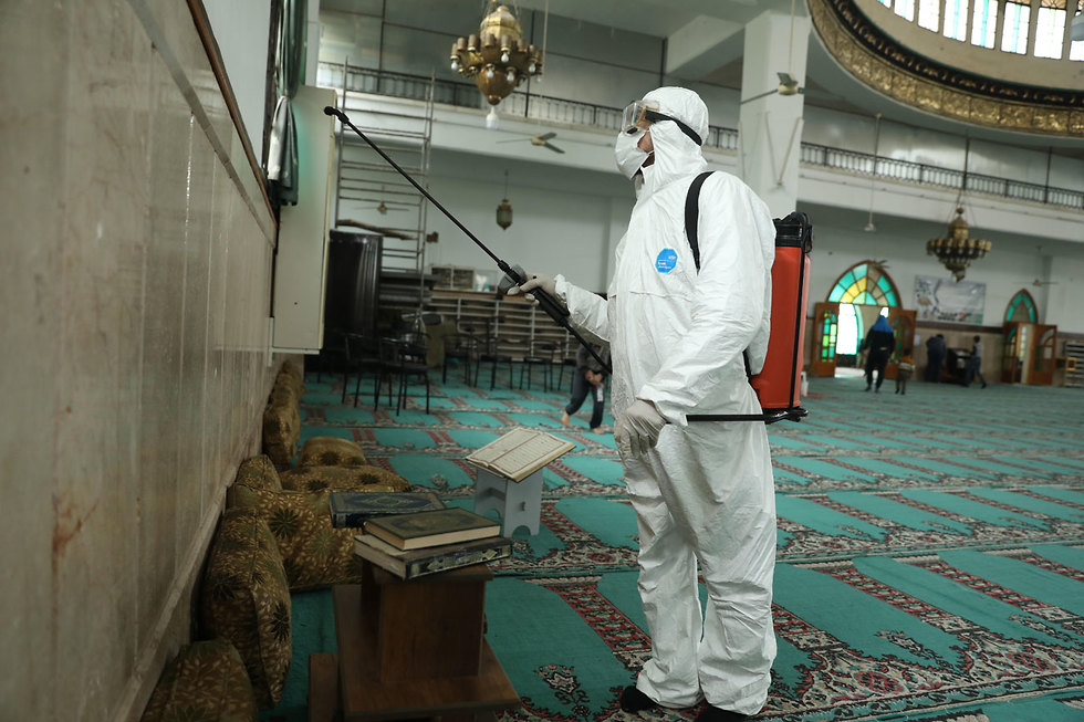 Health workers disinfecting a mosque in the Syrian city of Idlib  