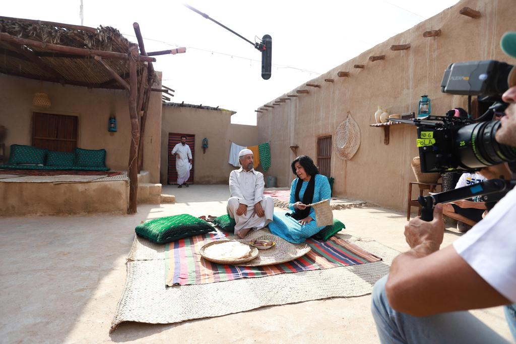 Omani actor Fakria Khamis (R) and Kuwaiti actor Mohammed Jaber (L) are seen at a shooting set during filming of MBC's ramadan Arabic series 'Umm Haroun' in Dubai 