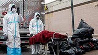 בית לוויה ב ניו יורק ארה"ב אחסן גופות במשאיות בשל עומס במגפת ה קורונה