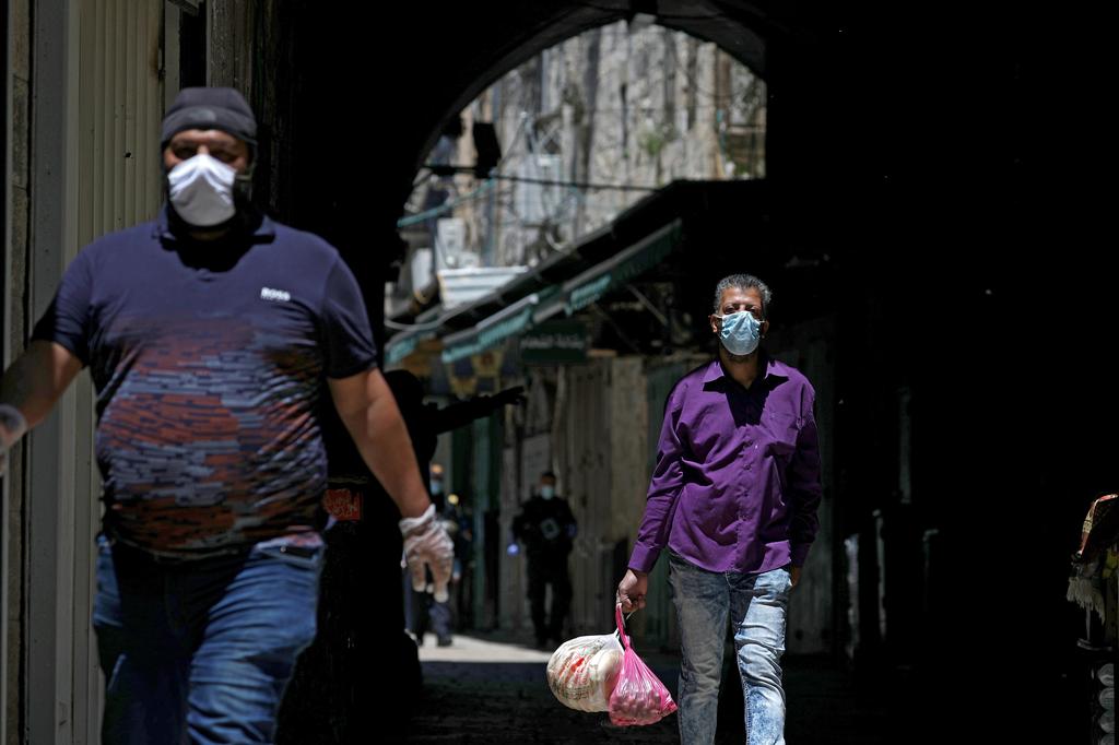 Palestinians wearing facial masks in the Old City of Jerusalem 