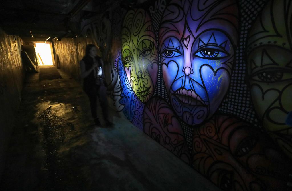 A woman makes her way through the VIP underground corridor at the premises of the former Pussycat strip club