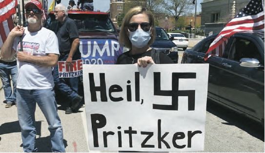 Anti lockdown protesters holding antisemitic signs in Illinois