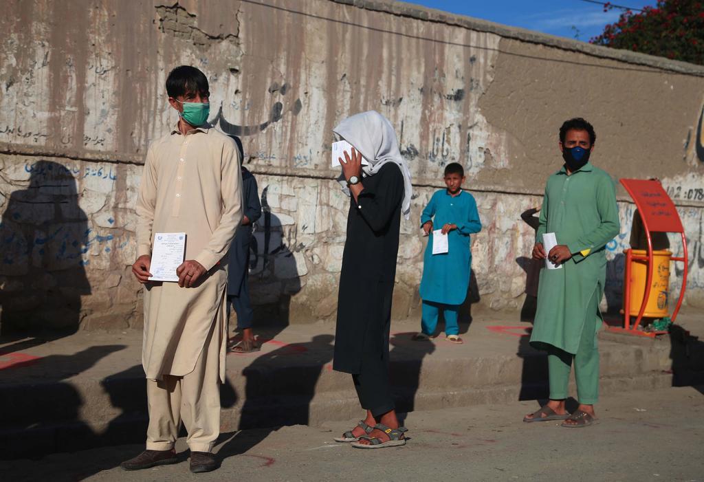 Afghans line up to receive free bread, an initiative of Afghan government to provide free bread to families in need amid the ongoing coronavirus COVID-19 pandemic, in Jalalabad, Afghanistan 