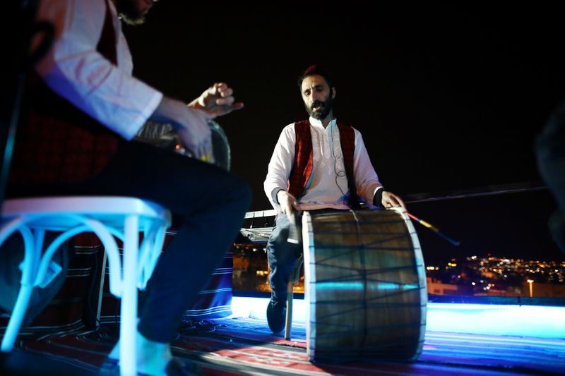 A festive Ramadan float play music as it drives through a street in East Jerusalem 