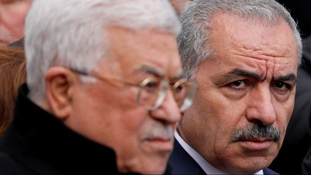 Palestinian Prime Minister Mohammad Shtayyeh and President Mahmoud Abbas attend the funeral of former senior Fatah official Ahmed Abdel Rahman, in Ramallah 