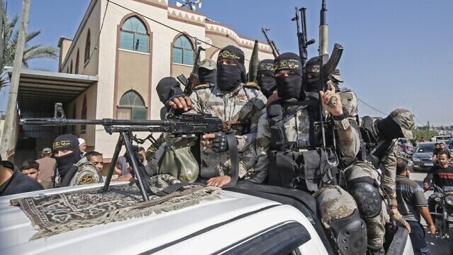 Palestinian Islamic Jihad terrorists attend the funeral of a fellow fighter in Khan Younis in the southern Gaza Strip 