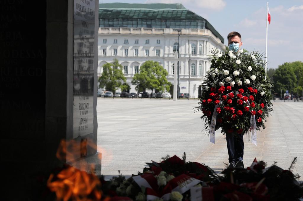 Independent presidential candidate Szymon Holownia during laying flowers ceremony at the Tomb of the Unknown Soldier marking the 75th anniversary of the Victory Day in Warsaw