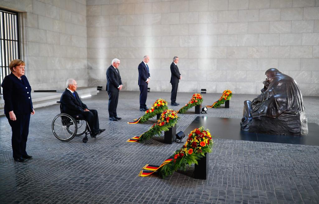 (L-R) German Chancellor Angela Merkel, Bundestag President Wolfgang Schaeuble, German President Frank-Walter Steinmeier, Bundesrat President and Brandenburg's state premier Dietmar Woidke, and President of Germany's Constitutional Court Andreas Vosskuhle attend a wreath laying ceremony to mark the 75th anniversary of the end of World War Two, at the Neue Wache Memorial in Berlin