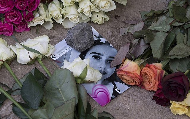 Roses cover the photo of the 14-year-old Susanna Maria Feldman killed in Wiesbaden, Germany 