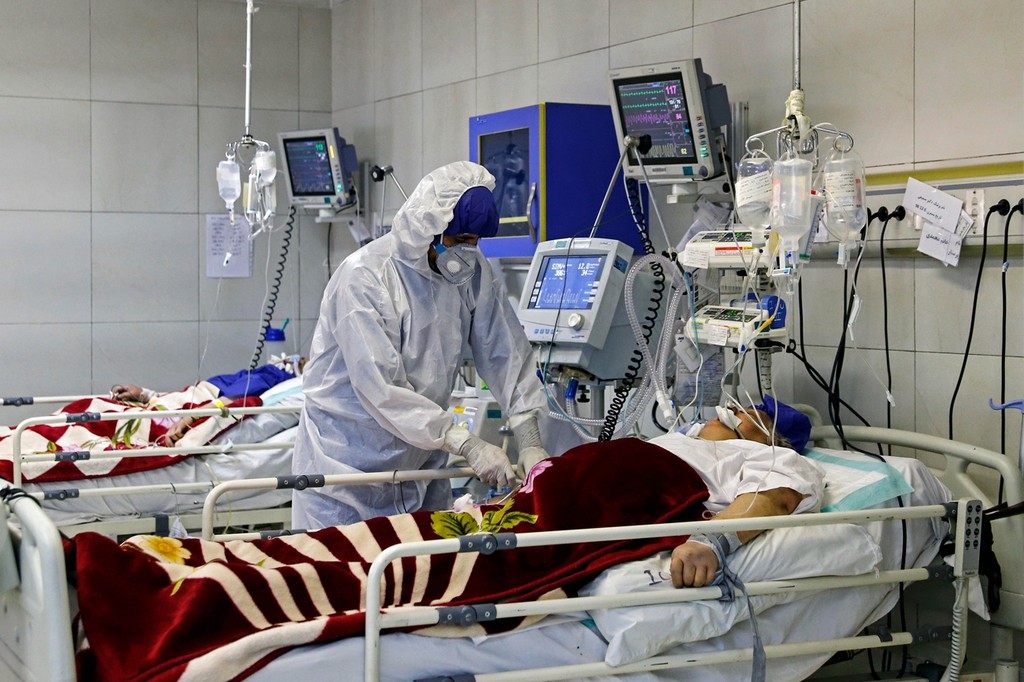COVID-19 patients receive treatment in a Tehran hospital 