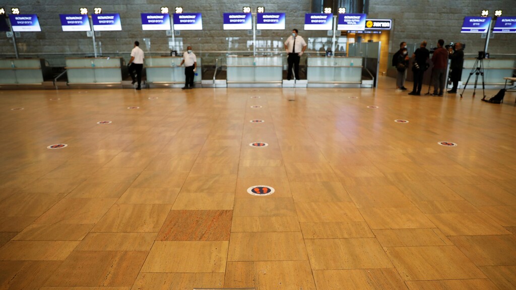 A social distancing marker is seen on the floor at the departures terminal at Ben Gurion Airport 