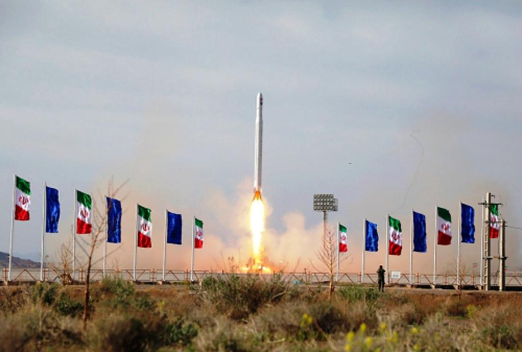 An Iranian rocket carrying a satellite is launched from an undisclosed site believed to be in Iran's Semnan province 