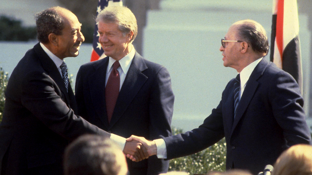 Egyptian President  Saadat, U.S. President Carter and Israeli Prime Minister Begin at the signing of the Israeli Egyptian peace treaty 