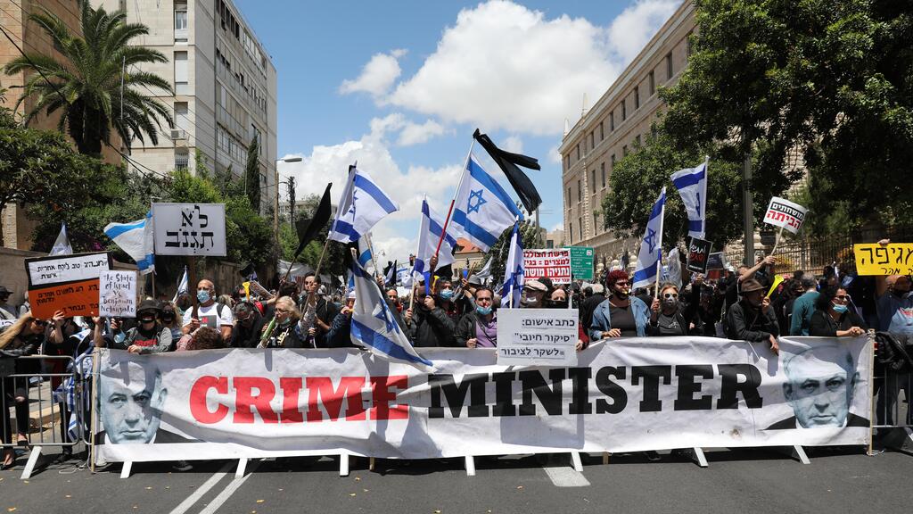 Netanyahu opponents protest outside the Prime Minister's Residence in Jerusalem, May 24, 2020 
