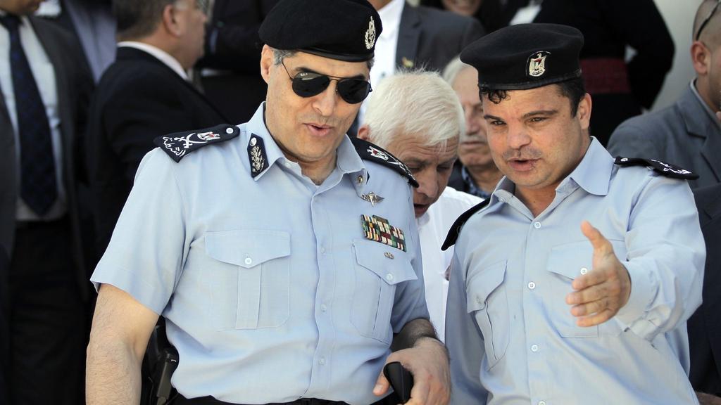 Palestinian Civil Police commander in the West Bank Maj. Gen. Hazem Atallah (L), arrives at Independence University, a security academy that trains police and security forces officers, to attend the inauguration ceremony of a mosque and a new part of the campus on May 1, 2015 in Jericho 