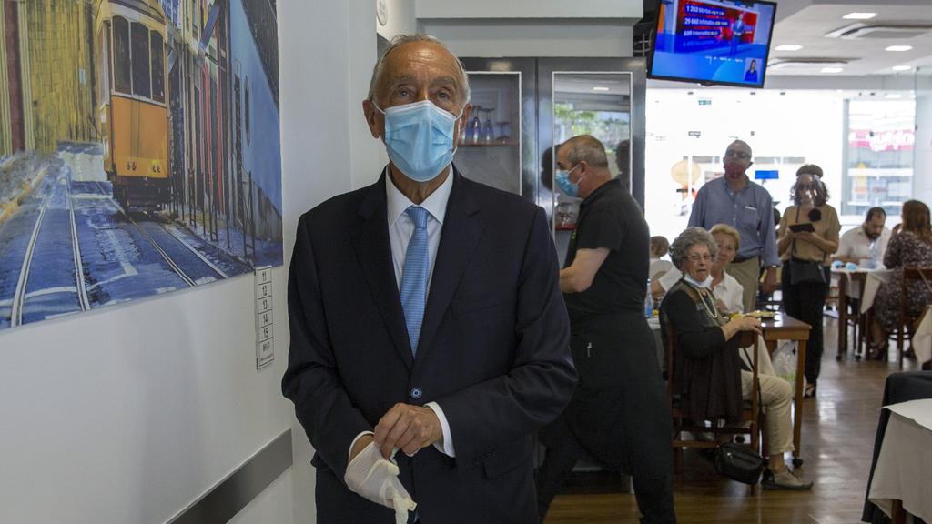 Portuguese President Marcelo Rebelo de Sousa, wearing a face mask for protection against coronavirus,