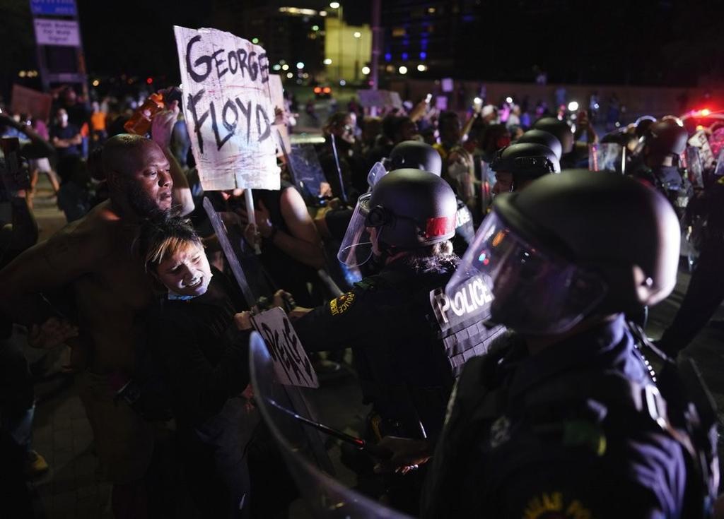 Protesters clash with Dallas police at Griffin and Young on Friday, May 29, 2020, in Dallas 