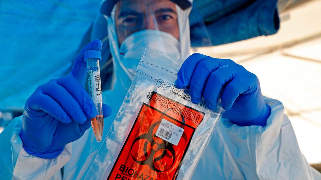  Анализы на коронавирус. Фото: AFP  