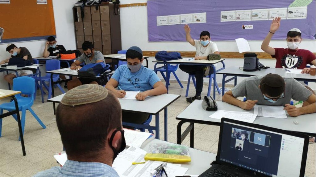 Students wear masks at a boys' school in Ma'ale Adumim