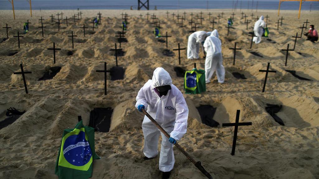  Teams dig graves on the beach in Brazil for coronavirus victims 