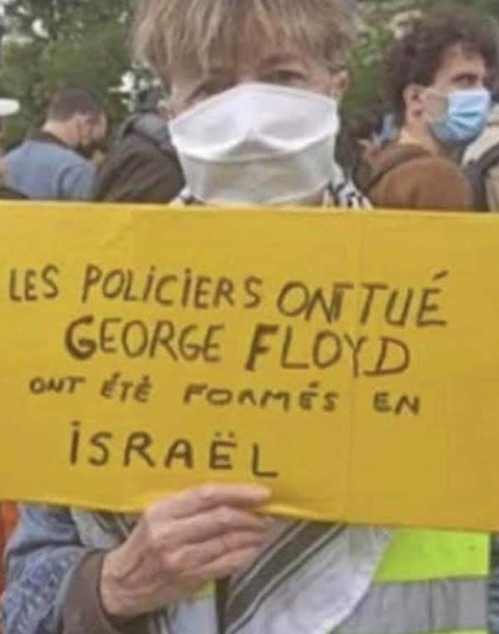  "Полицейские, убившие Флойда, обучались в Израиле", - гласит надпись на плакате