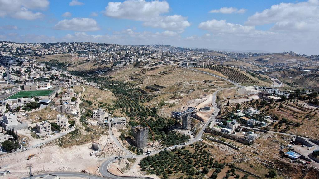 An aerial view shows a section of The American Road, an Israeli ring road being built near the Palestinian neighbourhood of Umm Tuba in East Jerusalem 