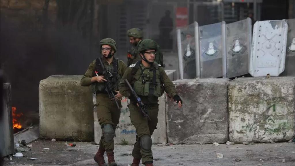 Israeli soldiers deploy during clashes with Palestinians in Hebron, West Bank