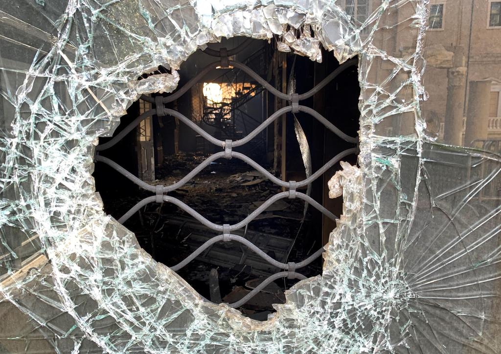 A view shows shattered glass of an abandoned bank branch that was set ablaze during overnight protests sparked by a rapid fall in the pound currency and mounting economic hardship in Beirut, Lebanon 