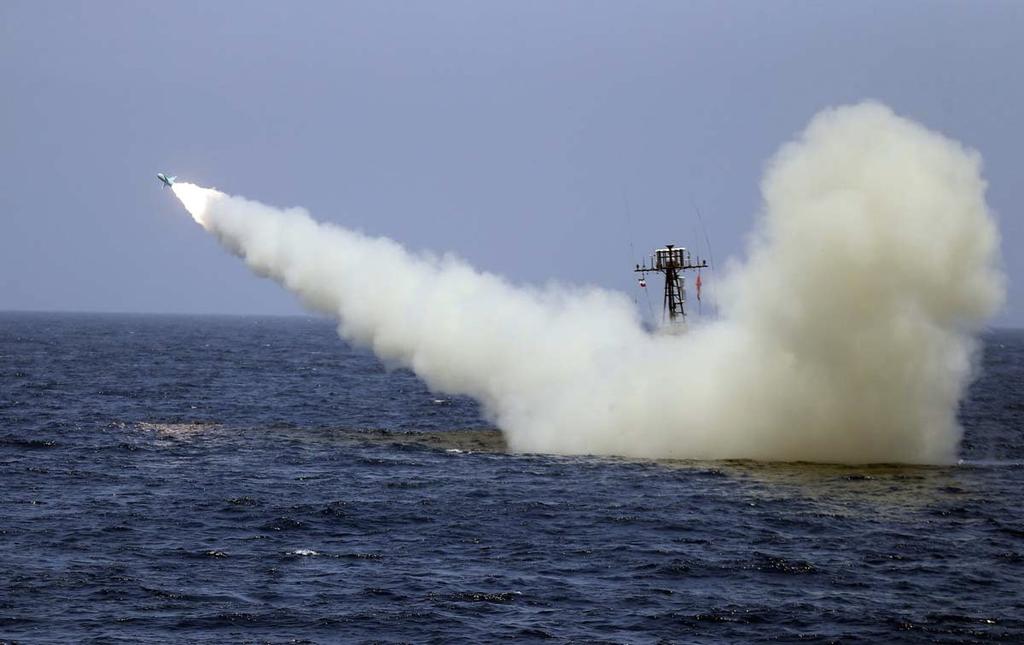 An Iranian warship launches a missile during a naval exercise 