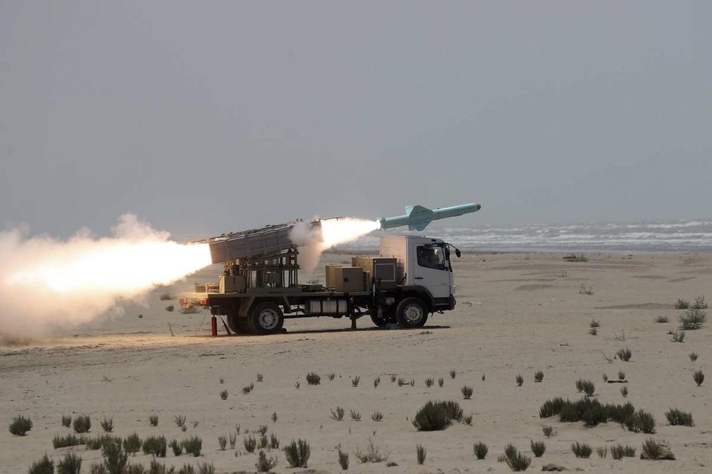 A missile is launched from a mobile platform during a naval exercise by the Iranian Army 