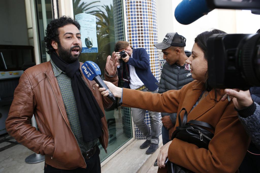Journalist and activist Omar Radi speaks to the media after his hearing at the Casablanca Courthouse 