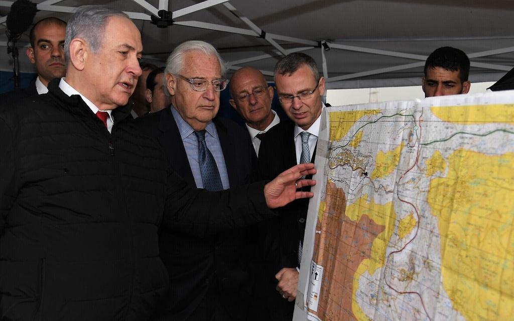 Prime Minister Netanyahu with U.S. Ambassador to Israel David Friedman and Knesset Speaker Yariv Levin examining a map of the West Bank  