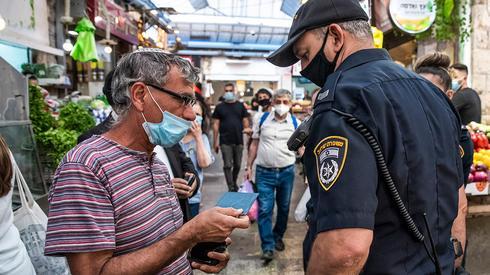 Jerusalem police enforce health directives to fight the spread of coronavirus 