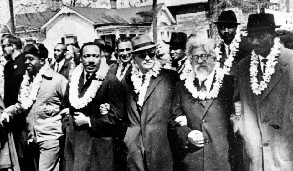 Rabbi Abraham Joshua Heschel, 2nd right, marching with Martin Luther King, 2nd left, in Selma, Alabama in 1965 