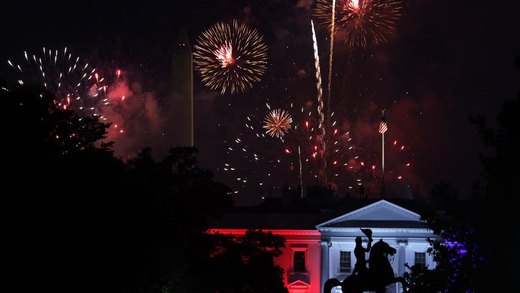 Fireworks explode behind the White House near the Washington Monument July 4, 2020 in Washington 