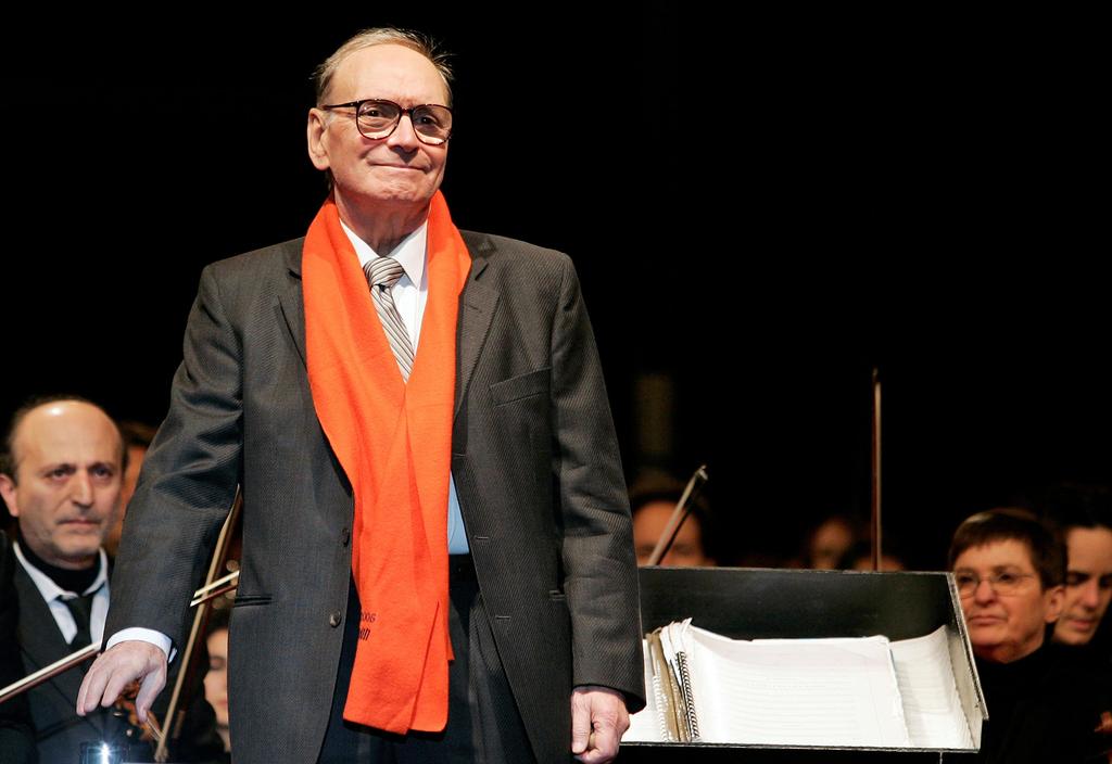 Italian movie composer Ennio Morricone conducts the Sinfonietta orchestra during a Christmas concert in Milan December 16, 2006 