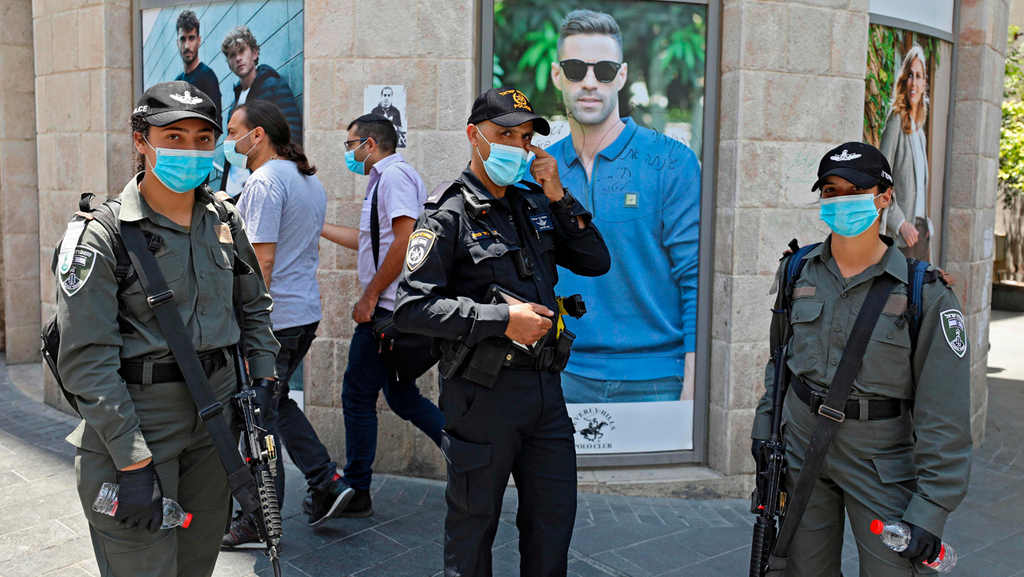  Police enforcing a mask mandate in Jerusalem earlier this year 