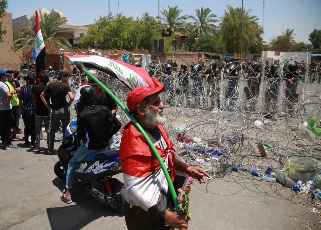 Iraqi riot police cordon off the heavily fortified Green Zone, which houses government buildings and foreign embassies, as demonstrators gather to protest against armed Iranian-backed militias, in Baghdad, Iraq 
