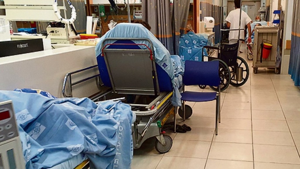 An overcrowded hospital ward with beds in the corridor in the time of coronavirus 