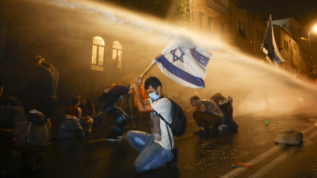  Israeli police uses water canon to disperse people during a protest against Israeli Prime Minister Benjamin Netanyahu In Jerusalem