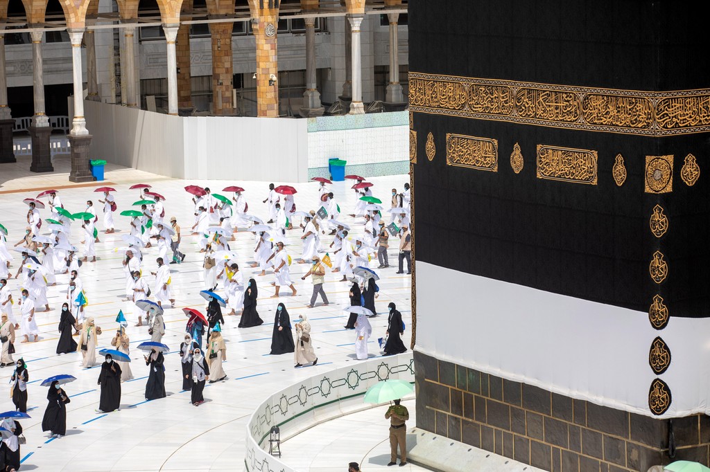 Pilgrims circle around the Kaaba at the Grand Mosque in Mecca on the first day of Hajj, July 29, 2020 