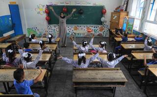 Palestinian students attend a class at a school run by The United Nations Relief and Works Agency (UNRWA) in Jabalia refugee camp in northern Gaza Strip 