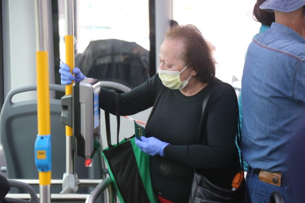 An elderly woman on a city bus in Tel Aviv 