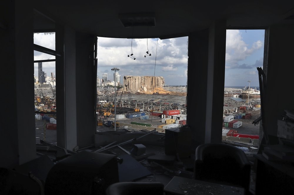 The scene of the explosion that hit the seaport of Beirut is seen through a damaged apartment in Beirut, Lebanon 